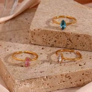 Detailed view of 18K gold plated adjustable rings with colorful marquise zircons