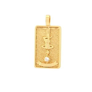 Detailed relief of gold plated Tarot Hanged Man pendant with white cubic zirconia inlay