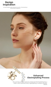 Close-up of curved gold stud earrings with graduated white stones and butterfly back