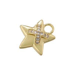 Macro shot of gold star-shaped pendant featuring an inlaid crystal cross detail