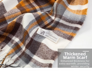 Detailed close-up of warm plaid cashmere scarf fabric texture and white label