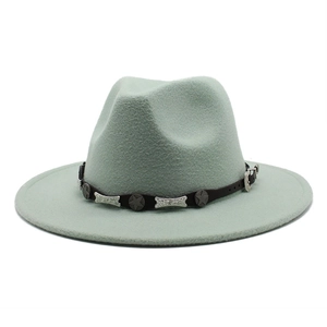 Detail of light green wool fedora hat with black leather band and silver star buckles