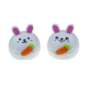 Pair of cute round Easter bunny pull-back toy cars with carrots on a white background