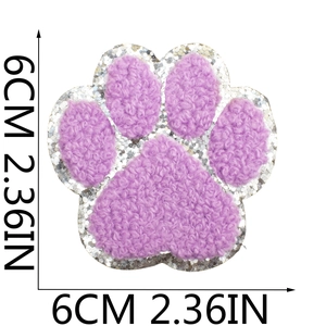 Purple chenille dog paw patch with silver glitter sequins and size measurements