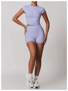 Detailed shot of the brushed lilac yoga crop top and matching high-waist sports shorts