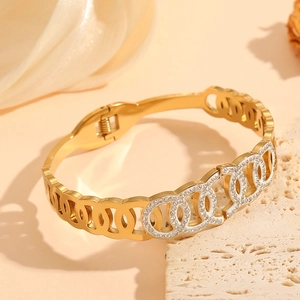 Gold plated stainless steel interlocking circle bangle with sparkling zircons on stone
