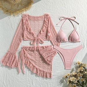 Detailed flat lay of pink three-piece bikini set with lace cover-up and rib fabric