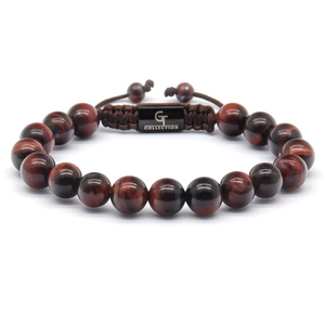 Detailed macro view of 10mm tiger eye beads with adjustable brown braided cord strap
