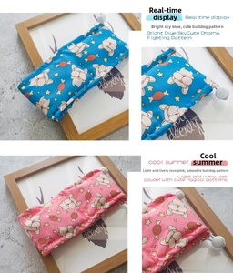 Detail of pet cooling scarves in blue and pink with French Bulldog prints and adjusters