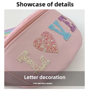 Close-up of pink sequin 'LOVE' letter patches and rainbow strap on kids waist bag