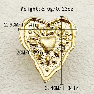 Macro view of gold plated heart ring featuring radial texture and size dimensions
