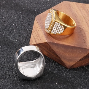 Detailed view of hip hop square signet rings with full pavé crystals in gold and silver