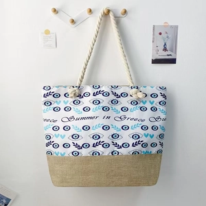 Canvas evil eye beach tote bag with thick rope handles and jute splice detailing