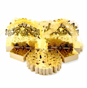 Detailed laser-cut golden butterfly candy boxes with elegant yellow ribbons