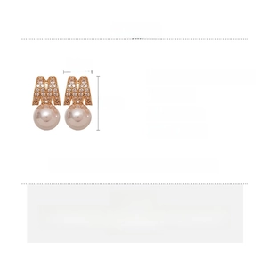Detail view of M-shaped letter earrings with zircon and pearls showing product dimensions