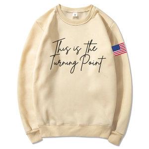 Unisex beige hooded sweatshirt with Turning Point text and US flag detail on the sleeve