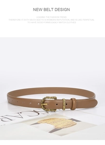 Close-up of brown leather belt with textured gold buckle on a white background