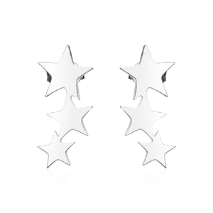 Macro shot of silver stainless steel triple star earrings with high polished finish