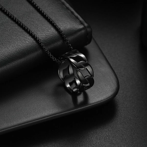 Punk black titanium steel chain link ring pendant necklace on a premium leather display