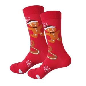 Detail of red Christmas crew socks featuring festive gingerbread man and snowflake patterns
