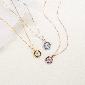 Collana con ciondolo tondo Malocchio in argento S925 nei colori oro argento e oro rosa