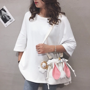 White canvas bucket bag featuring cute pink rabbit ears and a long adjustable strap