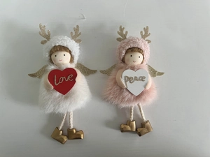 Detail of plush Christmas angels with golden wings, reindeer hats, and love/peace hearts
