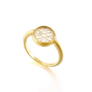 Golden flower hollow ring with white cubic zirconia crystals on white background