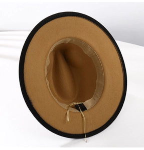 Detail view showing interior lining and adjustable strap of the two-tone jazz hat