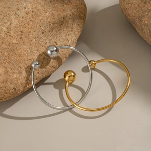Minimalist double ball open cuff bracelets in polished gold and silver finishes