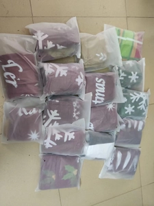 Detail of Christmas inflatable balls folded in frosted zipper bags for easy storage