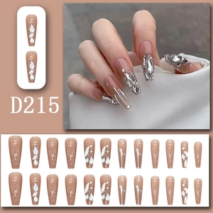 Detail of nude press-on nails D215 with glitter gradient, rhinestones, and coffin shape