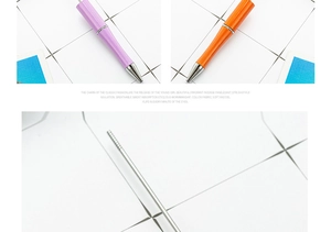 Detail view of purple and orange beaded pen barrels with silver metal tips and rods