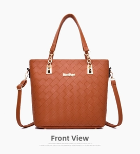 Detailed front view of brown woven tote bag featuring gold metallic logo and hardware