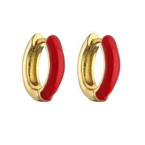 Close-up of gold huggie hoop earrings with vibrant red enamel finish on white background