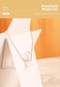 Detailed side view of star-shaped white jewelry display stand with simple foldable structure