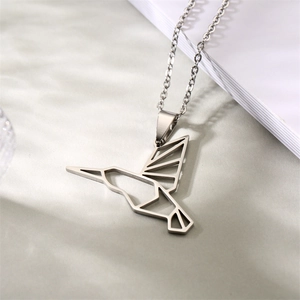 Detail of silver origami hummingbird pendant in stainless steel with a delicate chain