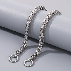 Detail of silver stainless steel dragon bone chain showing intricate woven link texture