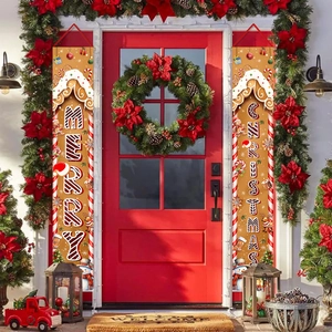 Gingerbread themed Christmas door banners with Merry Christmas text on a red house door