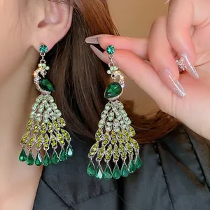 Peacock crystal tassel earrings with emerald green rhinestones and silver pins