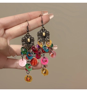 Detail view of Bohemian long dangle earrings featuring vintage bronze metal and colorful sequins