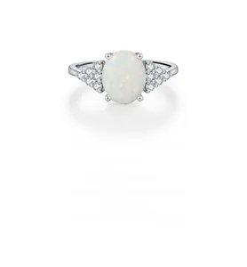 Macro shot of S925 silver ring featuring an oval white opal and sparkling side stones