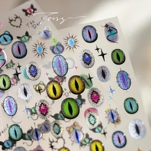 Macro shot of 3D mystic devil eye nail stickers with shimmering cat eye effect