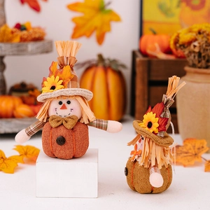 Macro shot of pumpkin scarecrow plush with autumn sunflower and maple leaf details