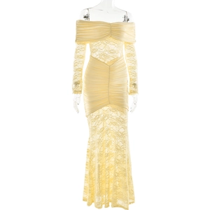 Detailed view of the yellow off-shoulder long sleeve dress with lace fishtail hemline