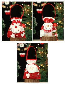 Detailed view of Christmas knit gift bags with 3D Santa, Snowman and Reindeer dolls