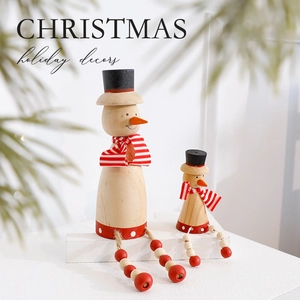 Standing wooden snowman Christmas ornaments with red striped scarves and top hats decor