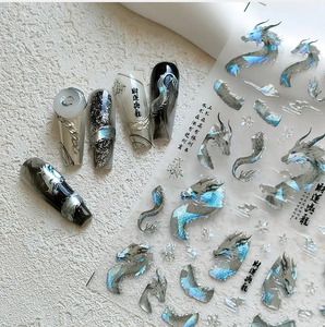 Close-up of 5D laser dragon nail stickers with Chinese calligraphy and silver nail art
