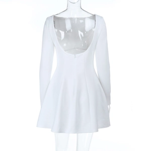 Detail view of a white backless long sleeve dress with a flared A-line mini skirt