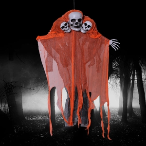 Detail of hanging Halloween skeletons with orange gauze in a spooky foggy forest